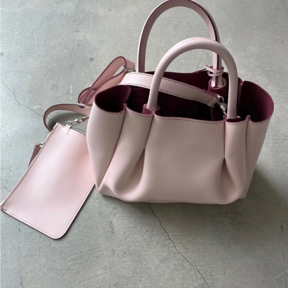 Alexandra De Curtis amalfi midi pink leather bag with maroon interior.